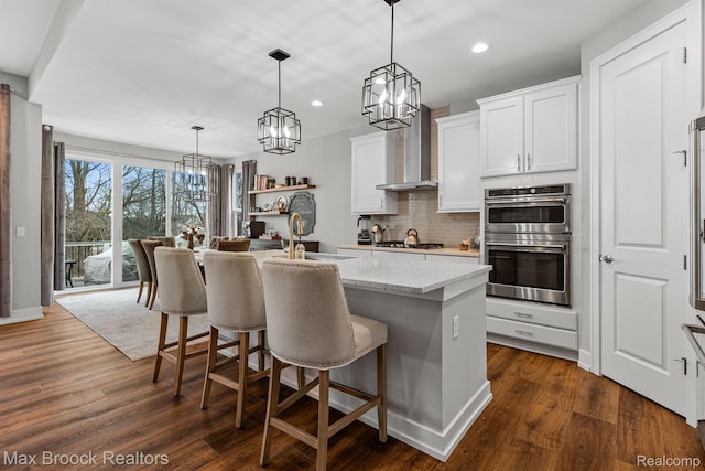 17170 Garden Ridge Ln Unit 72, Northville, MI 48168 - kitchen with appliances with stainless steel finishes, recessed lighting, a chandelier, backsplash, and a kitchen breakfast bar