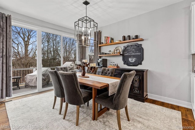 17170 Garden Ridge Ln Unit 72, Northville, MI 48168 - dining area with a chandelier and wood finished floors