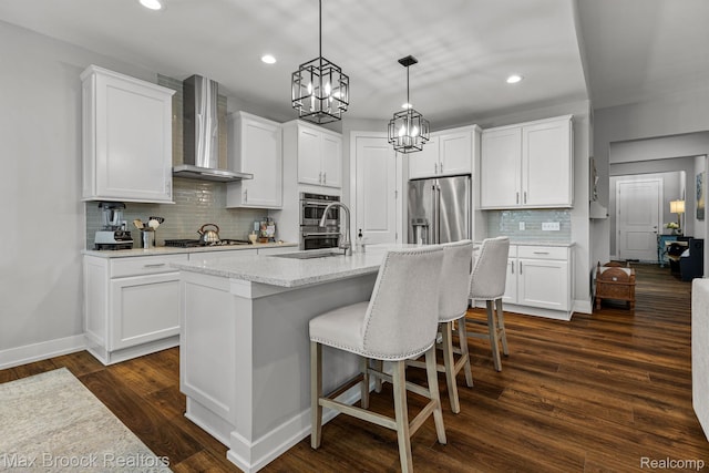 17170 Garden Ridge Ln Unit 72, Northville, MI 48168 - kitchen with wall chimney range hood, appliances with stainless steel finishes, recessed lighting, decorative backsplash, and an island with sink