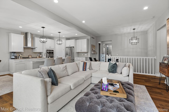 17170 Garden Ridge Ln Unit 72, Northville, MI 48168 - living room with a chandelier, recessed lighting, and dark wood-style floors