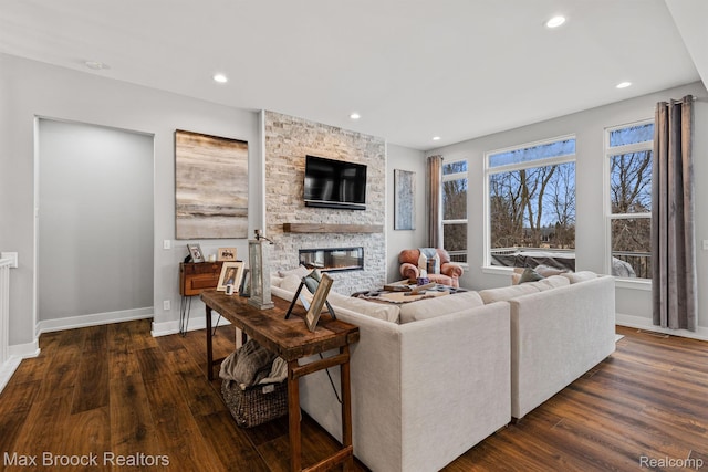 17170 Garden Ridge Ln Unit 72, Northville, MI 48168 - living area featuring a stone fireplace, dark wood-type flooring, and recessed lighting