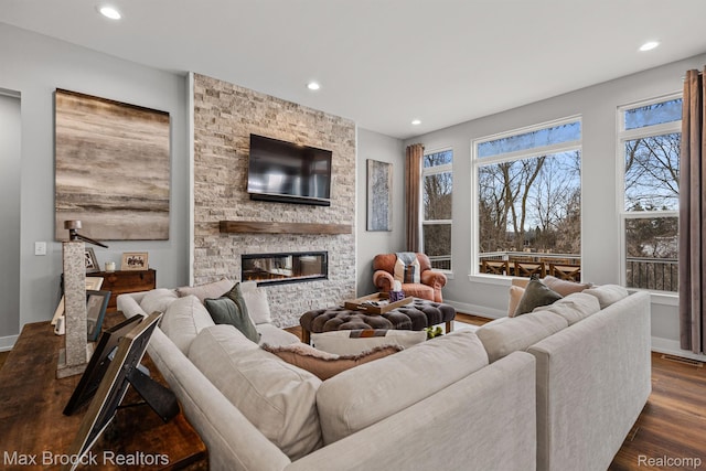 17170 Garden Ridge Ln Unit 72, Northville, MI 48168 - living area with a stone fireplace, dark wood-style floors, and recessed lighting
