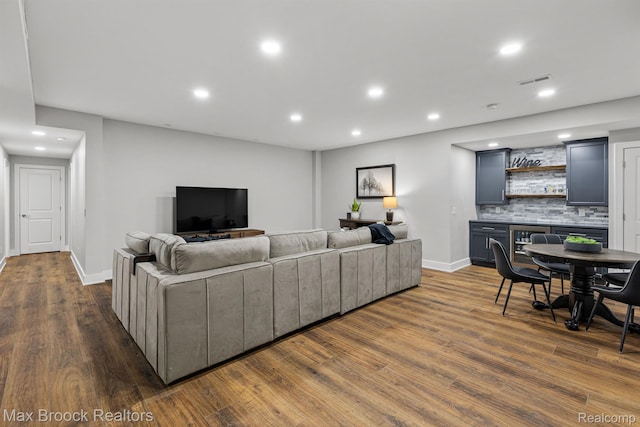 17170 Garden Ridge Ln Unit 72, Northville, MI 48168 - living room with recessed lighting, dark wood-style flooring, and bar