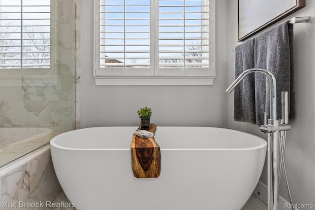 17170 Garden Ridge Ln Unit 72, Northville, MI 48168 - full bathroom featuring healthy amount of natural light, a freestanding tub, and a marble finish shower