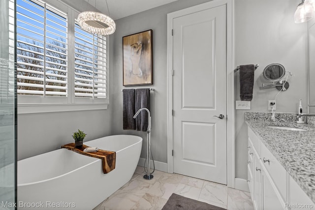 17170 Garden Ridge Ln Unit 72, Northville, MI 48168 - bathroom featuring marble finish floors, vanity, a freestanding tub, and a chandelier