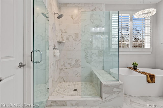 17170 Garden Ridge Ln Unit 72, Northville, MI 48168 - bathroom featuring marble finish floors, a soaking tub, a shower stall, and a chandelier
