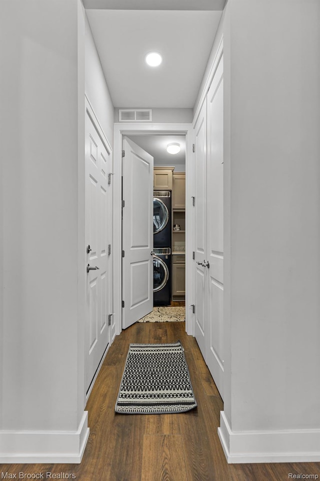 17170 Garden Ridge Ln Unit 72, Northville, MI 48168 - hall with stacked washing machine and dryer and dark wood-style floors