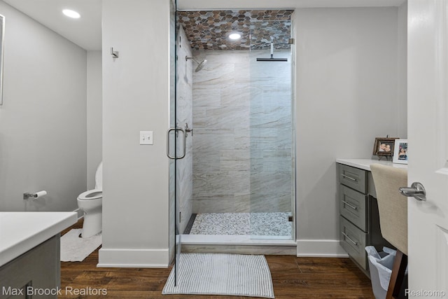 17170 Garden Ridge Ln Unit 72, Northville, MI 48168 - bathroom featuring vanity, a shower stall, wood finished floors, and recessed lighting