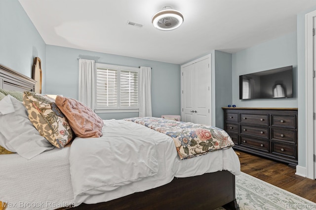 17170 Garden Ridge Ln Unit 72, Northville, MI 48168 - bedroom featuring dark wood finished floors and a closet