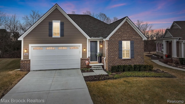 17170 Garden Ridge Ln Unit 72, Northville, MI 48168 - traditional-style house with brick siding, concrete driveway, a front lawn, a garage, and roof with shingles