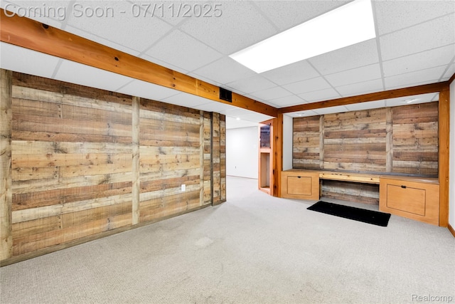 34019 Arrowhead St, Canton, MI 48185 - unfurnished living room featuring wooden walls, carpet, and a paneled ceiling