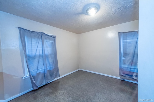 14599 Coyle St, Detroit, MI 48227 - carpeted spare room with a textured ceiling and baseboards