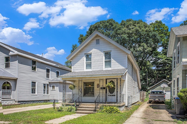 211 S 4th St, Niles, MI 49120 - view of front facade with a porch and concrete driveway