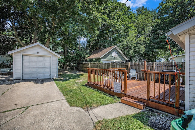 211 S 4th St, Niles, MI 49120 - fenced backyard with an outbuilding, driveway, a garage, and a deck