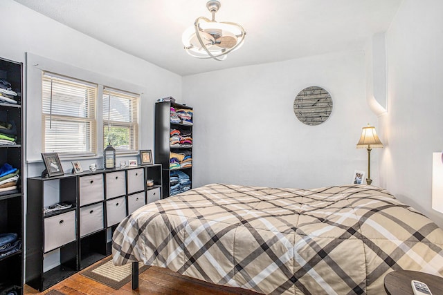 211 S 4th St, Niles, MI 49120 - bedroom featuring wood finished floors and a chandelier