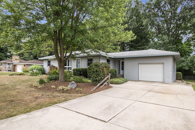 1200 Elmwood Dr, Jenison, MI 49428 - single story home with a garage, driveway, and a shingled roof