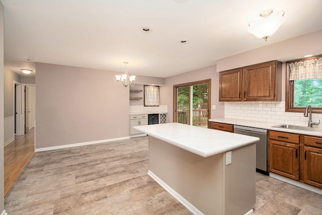 1200 Elmwood Dr, Jenison, MI 49428 - kitchen featuring dishwasher, brown cabinetry, healthy amount of natural light, and recessed lighting