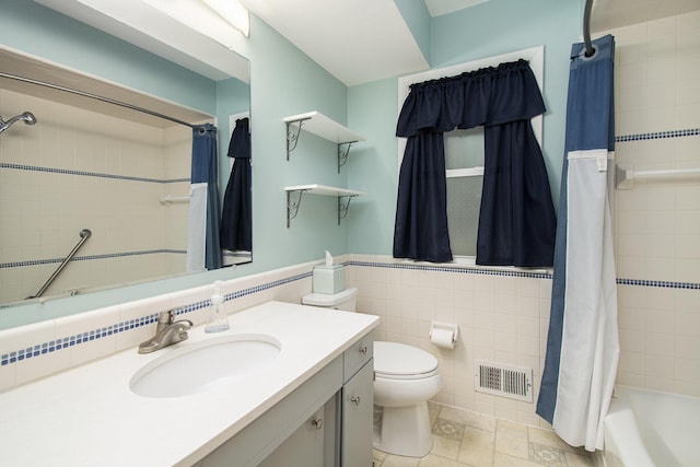 1200 Elmwood Dr, Jenison, MI 49428 - full bath featuring vanity, tile walls, shower / bath combo, and wainscoting