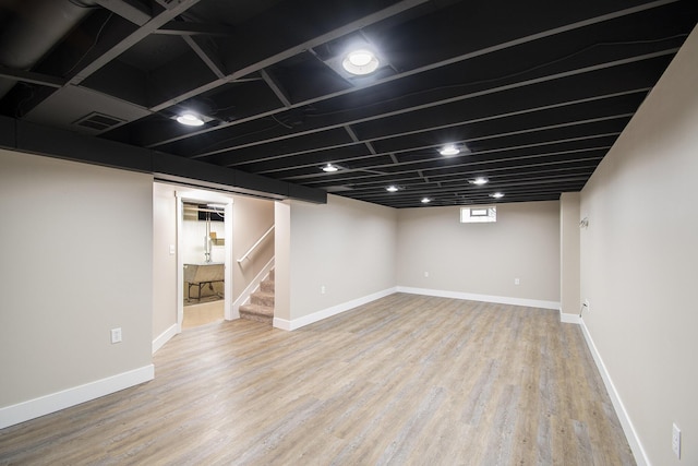 1200 Elmwood Dr, Jenison, MI 49428 - basement featuring wood finished floors and stairway
