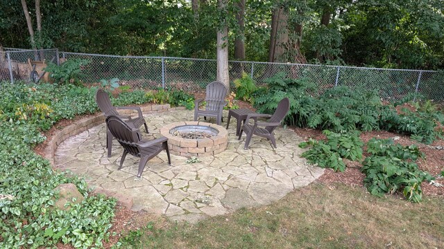 1200 Elmwood Dr, Jenison, MI 49428 - view of patio / terrace with an outdoor fire pit