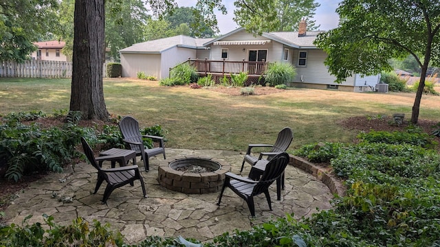 1200 Elmwood Dr, Jenison, MI 49428 - view of yard with a fire pit, a deck, and a patio