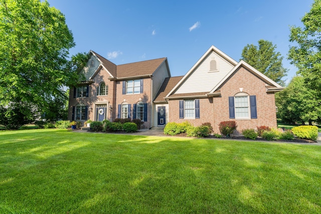 9095 Marsh Cir, Galesburg, MI 49053 - view of front of property with a front yard and brick siding
