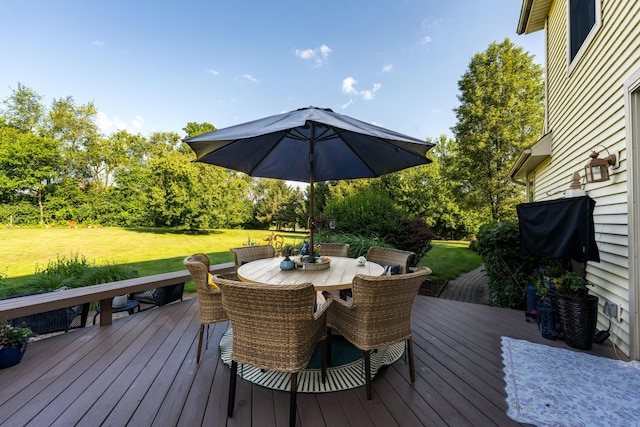 9095 Marsh Cir, Galesburg, MI 49053 - wooden terrace featuring outdoor dining space, a lawn, and view of scattered trees