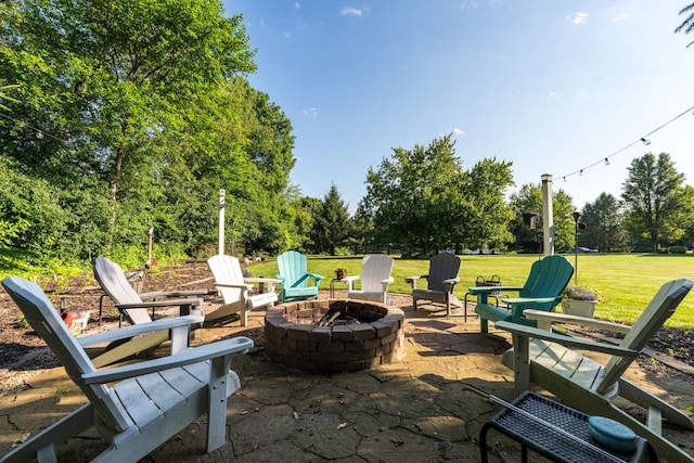 9095 Marsh Cir, Galesburg, MI 49053 - view of patio / terrace with a fire pit and view of scattered trees