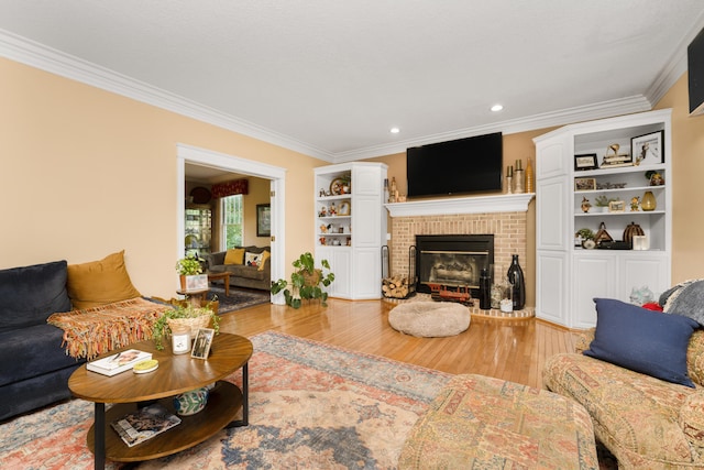 9095 Marsh Cir, Galesburg, MI 49053 - living area featuring crown molding, light wood finished floors, a fireplace, and recessed lighting