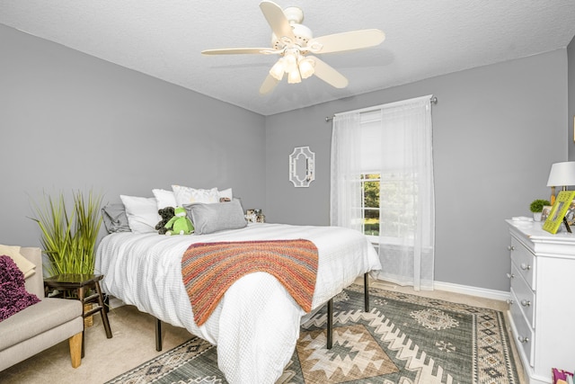9095 Marsh Cir, Galesburg, MI 49053 - bedroom featuring ceiling fan, a textured ceiling, and light carpet