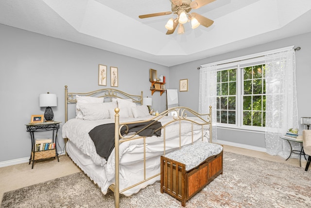 9095 Marsh Cir, Galesburg, MI 49053 - bedroom featuring light colored carpet, a raised ceiling, and ceiling fan