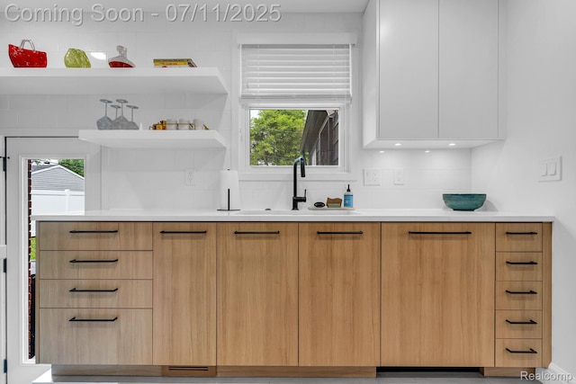 4607 Robinwood Ave, Royal Oak, MI 48073 - kitchen featuring modern cabinets, decorative backsplash, and light countertops