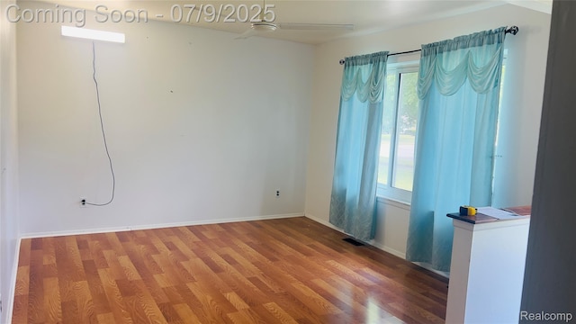 4224 Garrick Ave, Sterling Heights, MI 48091 - empty room with wood finished floors and a ceiling fan