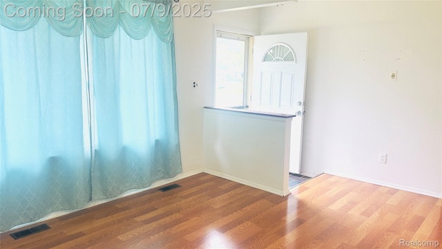 4224 Garrick Ave, Sterling Heights, MI 48091 - empty room featuring wood finished floors and baseboards