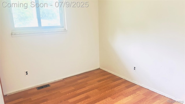 4224 Garrick Ave, Sterling Heights, MI 48091 - spare room with wood finished floors and baseboards
