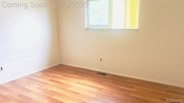 4224 Garrick Ave, Sterling Heights, MI 48091 - unfurnished room featuring light wood finished floors and baseboards