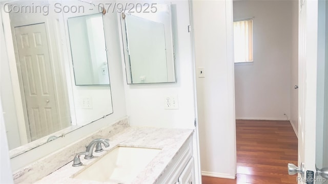 4224 Garrick Ave, Sterling Heights, MI 48091 - bathroom featuring wood finished floors and vanity