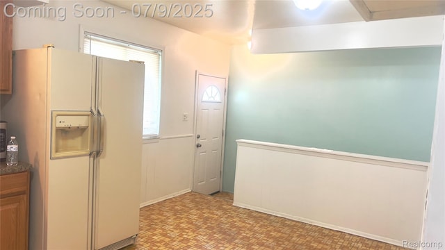 4224 Garrick Ave, Sterling Heights, MI 48091 - kitchen with white refrigerator with ice dispenser, light floors, and dark countertops
