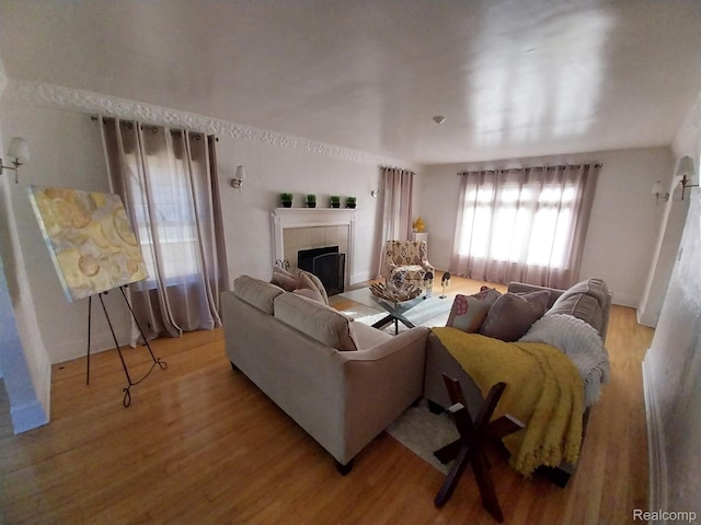 16834 Muirland St, Detroit, MI 48221 - living area with light wood-type flooring and a fireplace