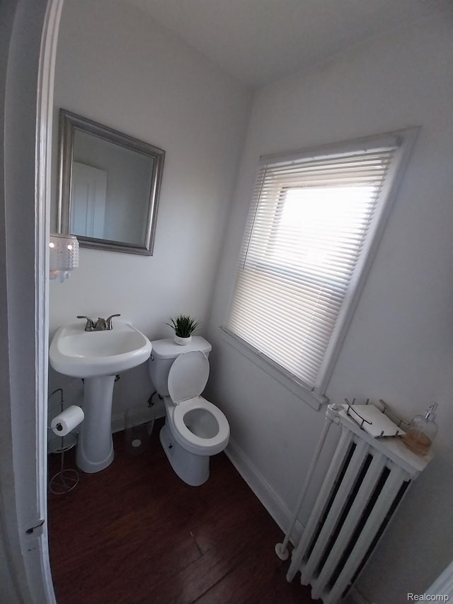 16834 Muirland St, Detroit, MI 48221 - bathroom featuring radiator and wood finished floors
