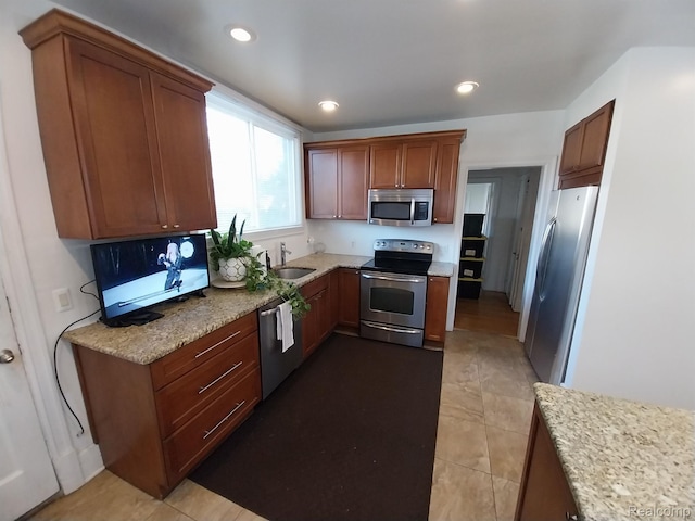 16834 Muirland St, Detroit, MI 48221 - kitchen with stainless steel appliances, tile patterned floors, light stone counters, and recessed lighting