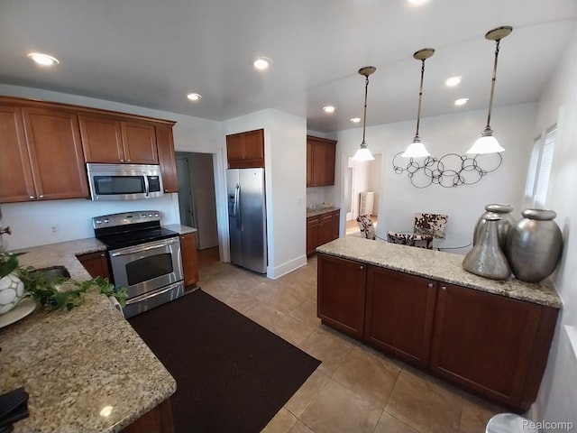 16834 Muirland St, Detroit, MI 48221 - kitchen featuring appliances with stainless steel finishes, light tile patterned flooring, decorative light fixtures, light stone countertops, and recessed lighting