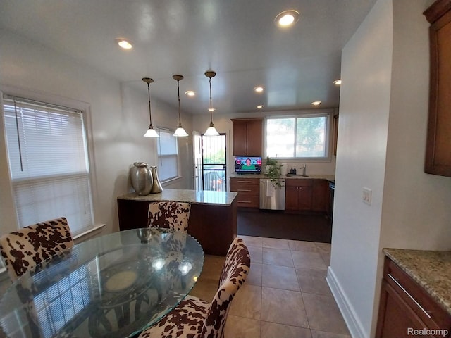16834 Muirland St, Detroit, MI 48221 - kitchen with dishwasher, tile patterned floors, pendant lighting, recessed lighting, and light stone countertops