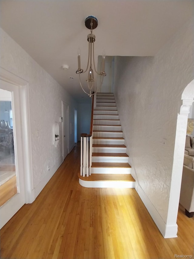 16834 Muirland St, Detroit, MI 48221 - staircase featuring wood finished floors and a textured wall