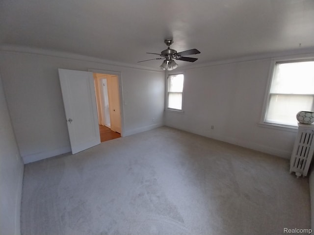 16834 Muirland St, Detroit, MI 48221 - unfurnished room with radiator, a ceiling fan, and light carpet
