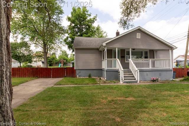 29046 S Wesley Ave, Flat Rock, MI 48134 - bungalow featuring a porch, a chimney, and a shingled roof