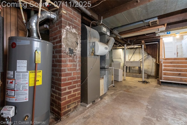 29046 S Wesley Ave, Flat Rock, MI 48134 - unfinished basement with gas water heater and washer / clothes dryer