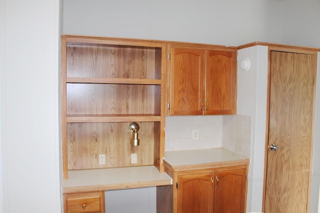 5249 Lapeer Rd, Burton, MI 48509 - kitchen with decorative backsplash, open shelves, and light countertops