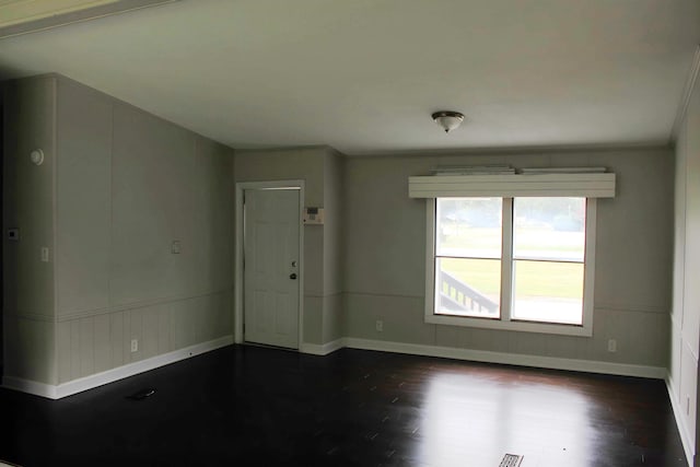 5249 Lapeer Rd, Burton, MI 48509 - spare room featuring baseboards and dark wood-type flooring