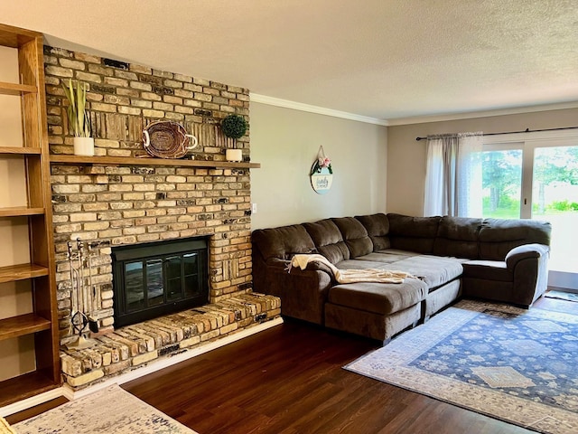 4865 Cactus Dr, Saginaw, MI 48603 - living area with dark wood-style floors, crown molding, a brick fireplace, and a textured ceiling
